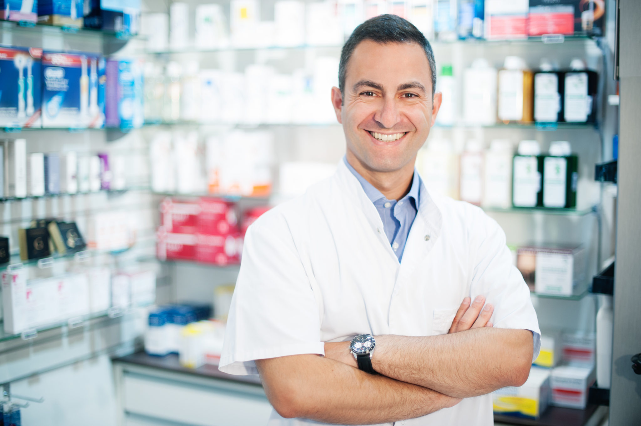cheerful smiling pharmacist chemist man standing in pharmacy Guardian Elder Care Main Office Located in Brockway, PA Pennsylvania